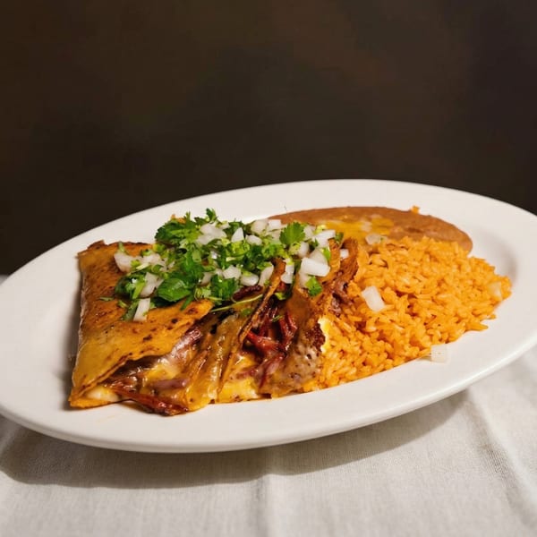 A quesadilla with melted cheese, cilantro, and onions, served with rice and refried beans.
